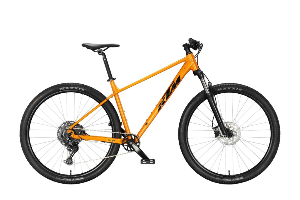 Rower KTM Chicago 291 2027 w kolorze Fresh Orange, widok z boku.